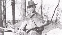 Commercial Fisherman, George May  with a fish