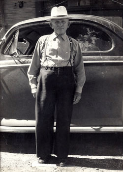 Anton Schofield in front of his car