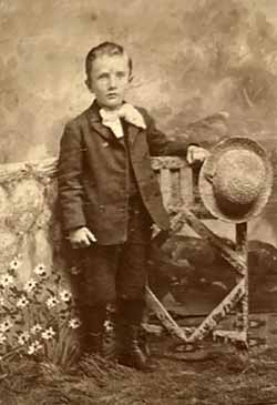 Boy with straw hat and flowers